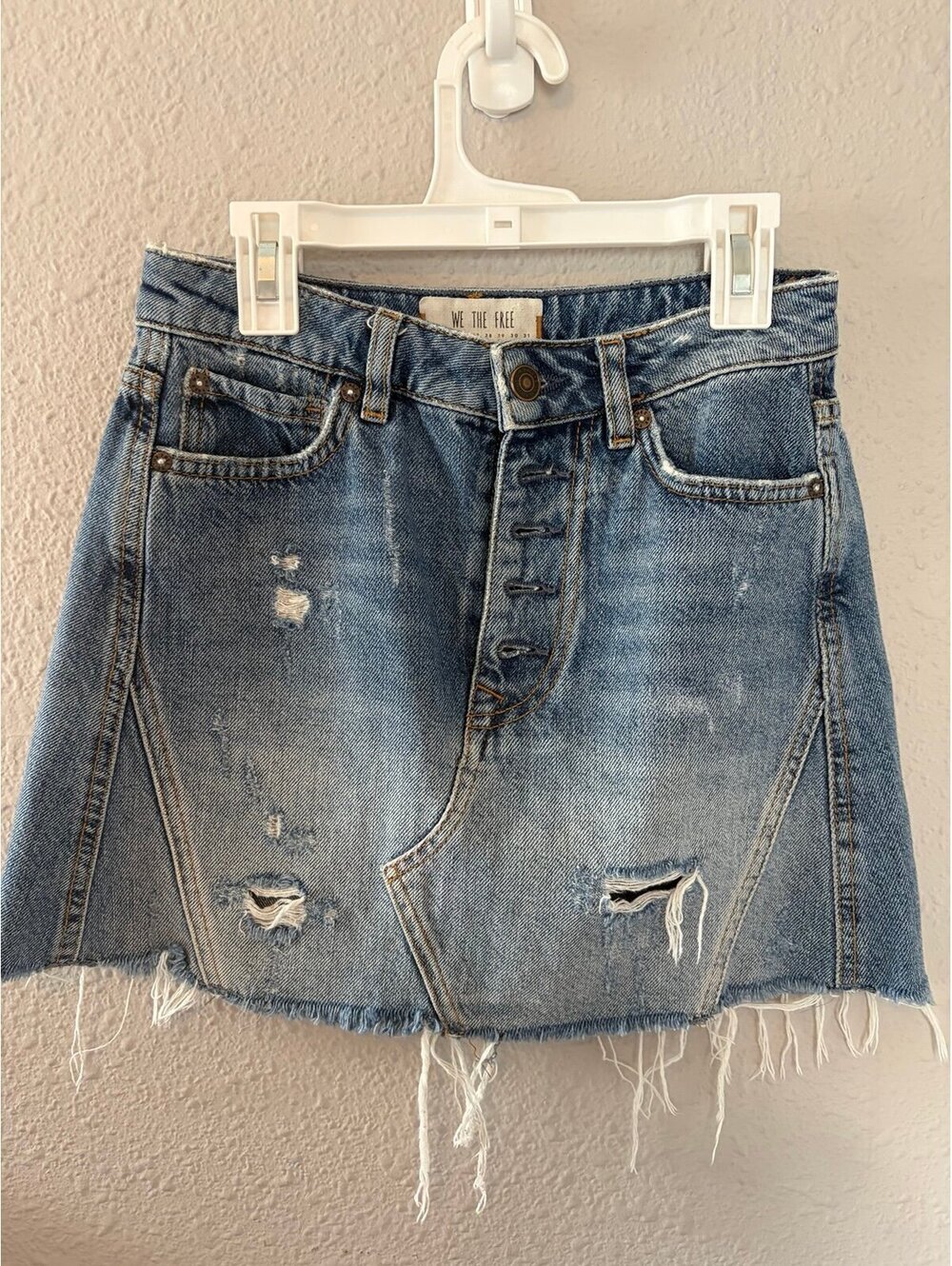 We The Free Denim Skirt size 24. Waist measures 13in. Distressing on back